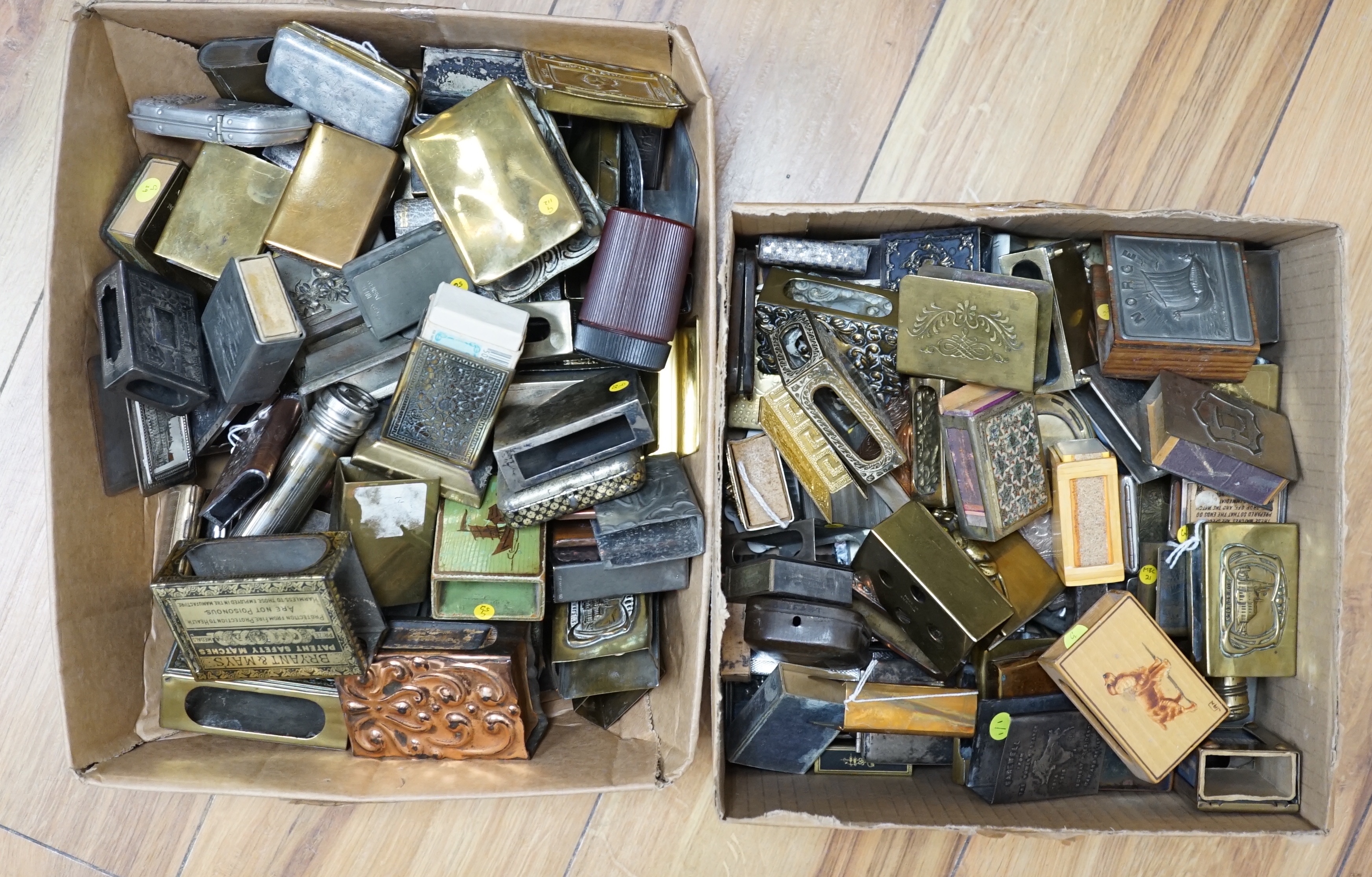 Two boxes of mixed metal matchbox holders including brass and copper